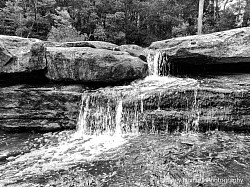 Water falling from different ledges near the falls