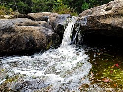 Water gushes from the ledge