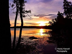 Sun setting over the calm water